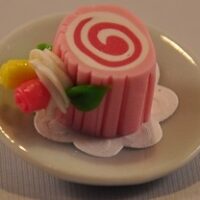 Swiss roll on china plate